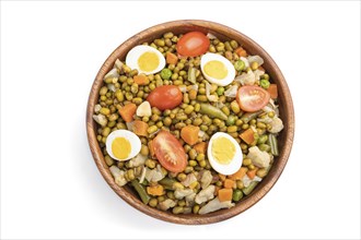 Mung bean porridge with quail eggs, tomatoes and vegetables isolated on white background. Top view,