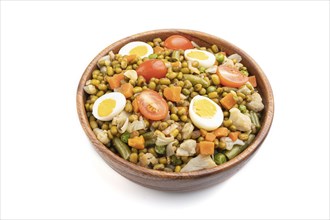 Mung bean porridge with quail eggs, tomatoes and vegetables isolated on white background. Side