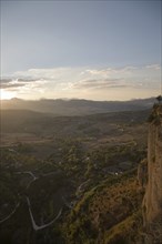 View over countryside and mountains at dusk from Ronda, Spain, Europe