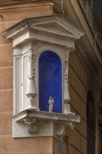 Niche on a corner house with a small statue of a saint, Genoa, Italy, Europe