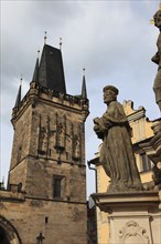 The Saints on Charles Bridge and the Lesser Town Bridge Tower, Prague, Czech Republic, Europe