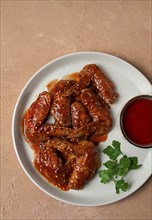 Chicken wings, with barbecue sauce, with tomato sauce, fast food, no people