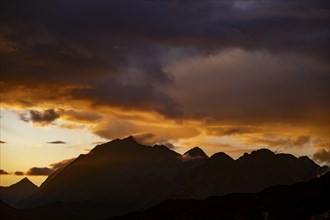 Montafon mountains with dramatic cloudy sky at sunset, Tschagguns, Rätikon, Montafon, Vorarlberg,