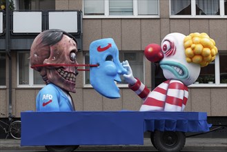 Behind the mask of the AFD is the skull of Hitler, papier-mâché figures, satirical float by Jacques