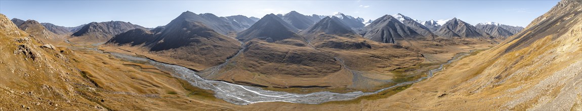 Aerial view, Burkhan mountain valley with meandering river, barren dramatic mountain landscape,