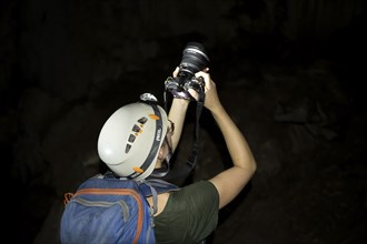 Young woman photographed in a stalactite cave, Terciopelo Cave, Barra Honda National Park, Costa