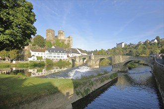 Old Lahn bridge built 1448 with castle built 12th century, Lahn valley, reflection, weir, historic