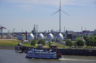 Europe, Germany, Hamburg, Köhlbrandhöft sewage treatment plant, view of the digestion towers, Elbe