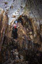 Woman exploring stalactite cave, Terciopelo Cave, Barra Honda National Park, Costa Rica, Central