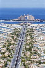 The Palm Jumeirah with Atlantis Hotel artificial island from above in Dubai, United Arab Emirates,