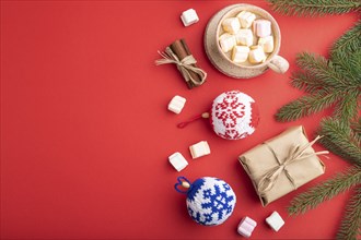 Christmas or New Year composition. Decorations, box, cinnamon, knitted balls, fir and spruce