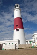 Red and white lighthouse on the coast at Portland Bill, isle of Portland, Dorset, England, United