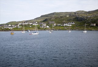 Yachts moored in the harbour at Castlebay, Barra, Outer Hebrides, Scotland, UK