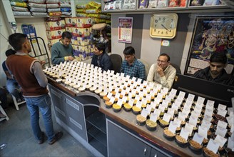 Samples of pulses kept on display inside a shop at a wholesale market ahead of the presentation of