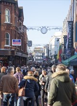 Crowds of people Christmas shopping in town centre of Ipswich, Suffolk, England, UK