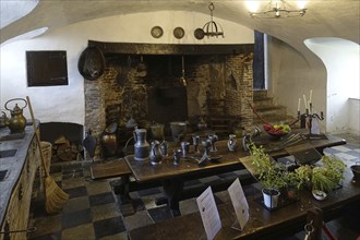 Kasteel van Laarne, interior showing kitchen and open fireplace inside 14th century medieval moated