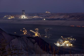 Lignite excavators extract coal in the Welzow open-cast mine, operated by LEAG. The lignite is