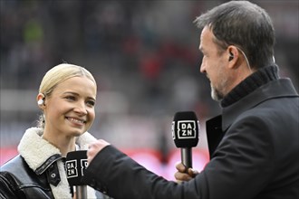 DAZN presenter Lena Cassel, portrait, smiles, interview with TV expert Fredi Bobic, microphone,