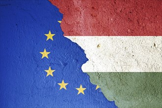 The European and Hungarian flags on a cracked stone background