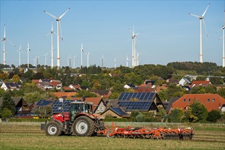 Wind farm above the village of Lichtenau, self-proclaimed energy town, houses with photovoltaic