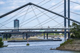 Pedestrian bridge over the Medienhafen, harbour entrance and Rheinkniebrücke, over the Rhine near