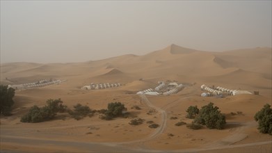 Sandstorm in the desert, desert camps and tents, dunes, Erg Chebbi, Sahara, Merzouga, Morocco,