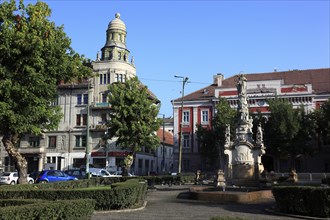 At Piata Libertatii, Freedom Square, Old Town Hall behind the baroque Marian column with St John of