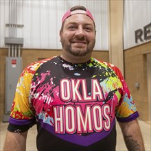 Oklahoma City, Oklahoma, An attendee shows off his shirt at the Great Plains Rodeo, an annual gay