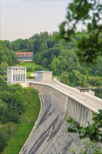 Large dam with neighbouring buildings in a densely wooded area, Rappbodetalsperre, Harz Mountains,