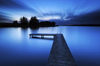 Quiet lake with bathing jetty after sunset, bathing area, Mecklenburg Lake District,