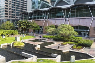 Modern building with a small garden and cascade pond