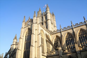 English flag flying on the tower of the Abbey church, Bath, Somerset, England, United Kingdom,