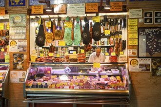 Butcher's stall in historic market building in Triana, Seville, Spain, Europe