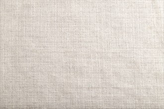 Fragment of smooth white linen tissue. Top view, flat lay, natural textile background and texture