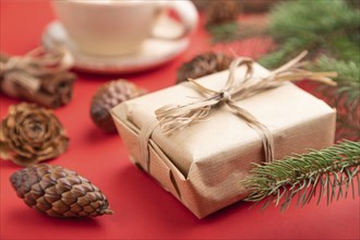 Christmas or New Year composition. Decorations, box, cinnamon, cones, fir and spruce branches, cup