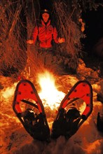 A man washes his hands by the campfire, Muddus National Park, World Heritage Laponia, Lapland,