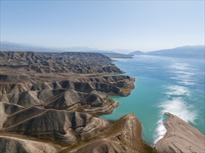 Barren landscape, aerial view, erosion landscape with canyons on the Naryn River, Toktogul