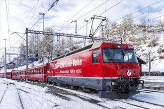 Rhaetian Railway train on the Albula railway Passenger train at Filisur station, Switzerland,