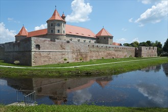 Medieval castle with red roofs, surrounded by a moat with a reflection, fortress, Fagaras, Fagara?,