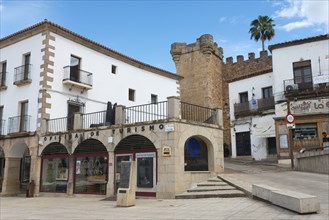 A tourist office and historic building in a sunny, cobbled square, Plaza Mayor, Cáceres, Caceres,