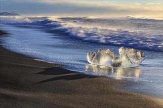 Ice floes on the beach, waves, sunny, morning mood, winter, Diamond Beach, Breidamerkursandur,