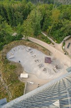 Aerial view of a large lettering 'Harzdrenalin' made of stones in a forest, Rappbodetalsperre,