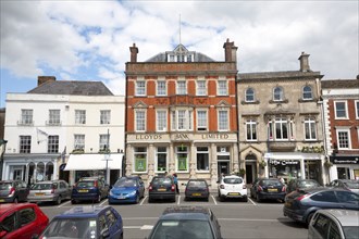 Lloyds Bank Limited building and shops in the Market Place, Devizes, Wiltshire, England, United