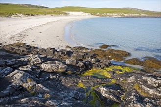 Rocky headland and sandy beach at Bagh a Deas, South Bay, Vatersay island, Barra, Outer Hebrides,