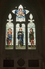 Stained glass window in Malmesbury abbey, Wiltshire, England, UK, Faith, Courage, Devotion by