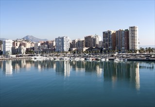 Apartment blocks and yachts in marina of Muelle Uno port development, city of Malaga, Spain, Europe