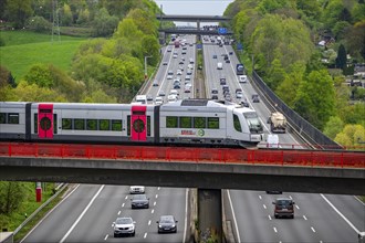 Local train S-Bahn, Regiobahn, S28, crossing the motorway A3, traffic on 8 lanes, incl. the