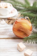 Christmas or New Year composition. Decorations, box, balls, cinnamon, fir and spruce branches, cup