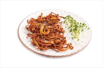 Fried Cordyceps militaris mushrooms isolated on white background with microgreen, herbs and spices.