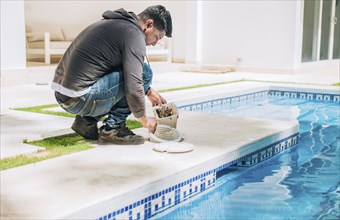 Man cleaning swimming pool filter basket. Person cleaning garbage filter basket for swimming pool